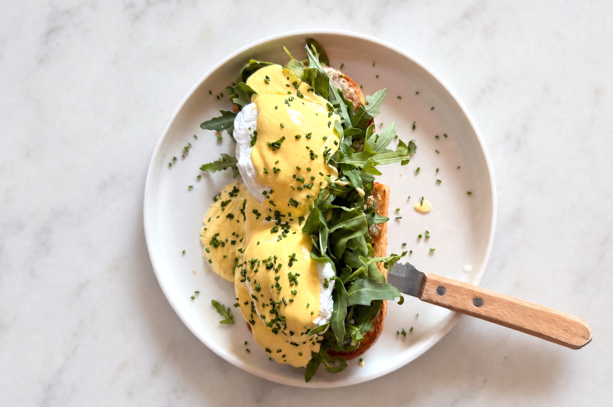 Sourdough sandwich with cream cheese, avocado, two poached eggs and hollandaise sauce — Café Miro