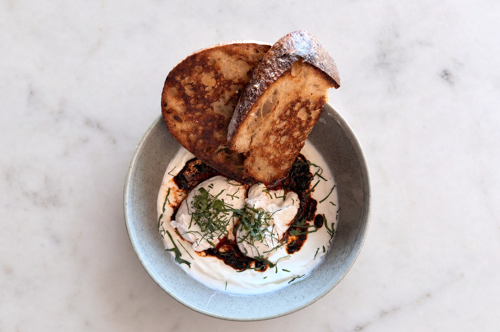 Turkish Eggs with yoghurt, poached eggs, chilli butter and sourdough — Café Miro